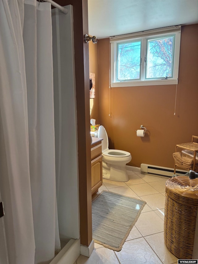 bathroom featuring a shower with shower curtain, vanity, baseboard heating, tile patterned floors, and toilet