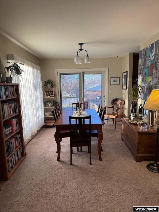 view of carpeted dining space