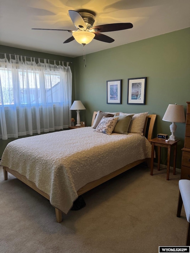bedroom with carpet flooring and a ceiling fan