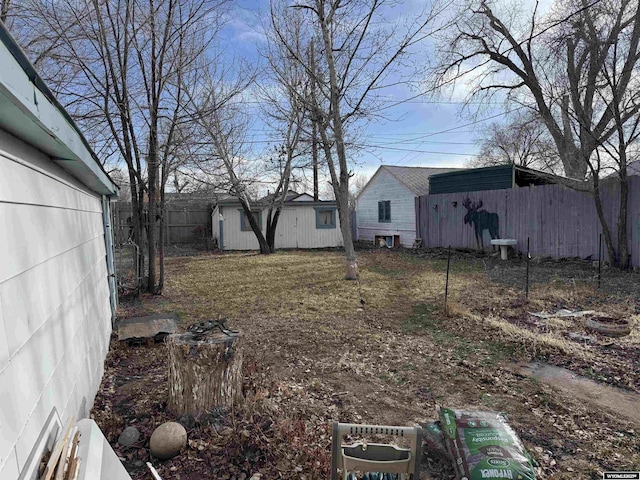 117 W Madison, Riverton, WY 82501 - view of yard with an outdoor structure and fence