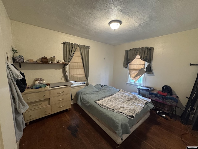 117 W Madison, Riverton, WY 82501 - bedroom with hardwood / wood-style floors and a textured ceiling