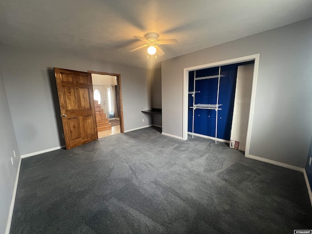 unfurnished bedroom with a closet, baseboards, ceiling fan, and carpet