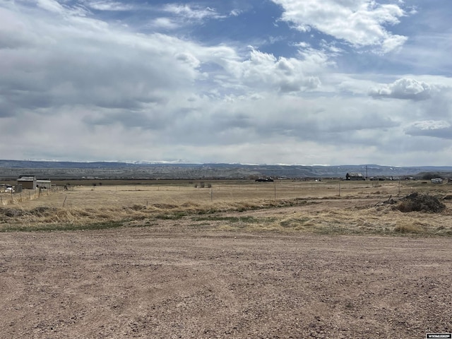 view of yard with a rural view