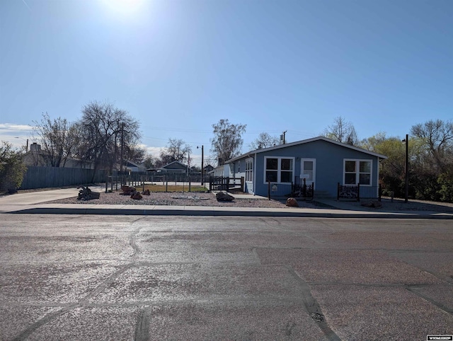 view of front of property featuring fence