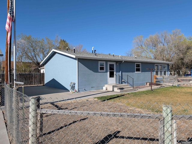 view of front of property with a front yard, a patio, and fence private yard