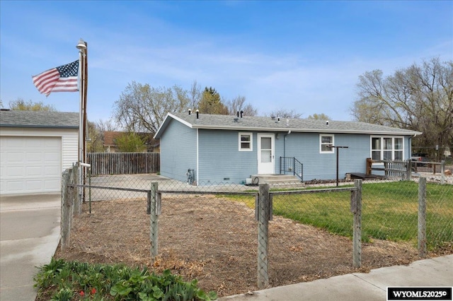 view of front of home featuring a front lawn, driveway, a garage, and fence private yard