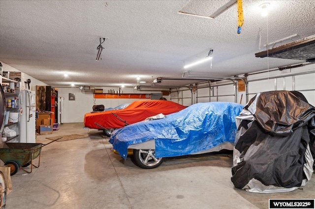 garage featuring freestanding refrigerator