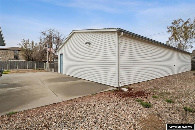 view of outbuilding with fence