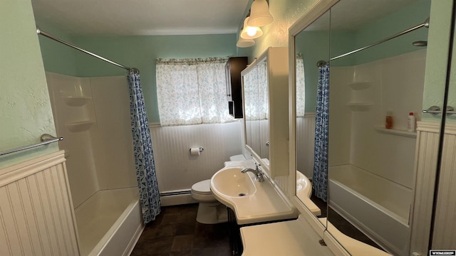 full bath with a baseboard radiator, shower / bathtub combination with curtain, toilet, and wainscoting