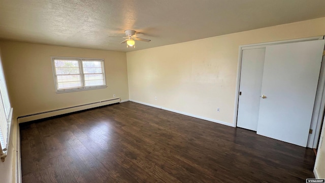 unfurnished bedroom featuring dark wood finished floors, a baseboard radiator, baseboards, and a ceiling fan