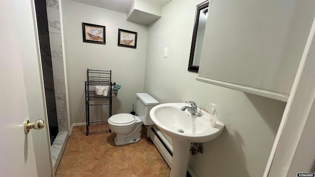 full bathroom with a baseboard heating unit, a shower, and toilet