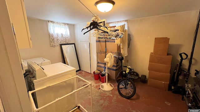 washroom featuring separate washer and dryer and laundry area