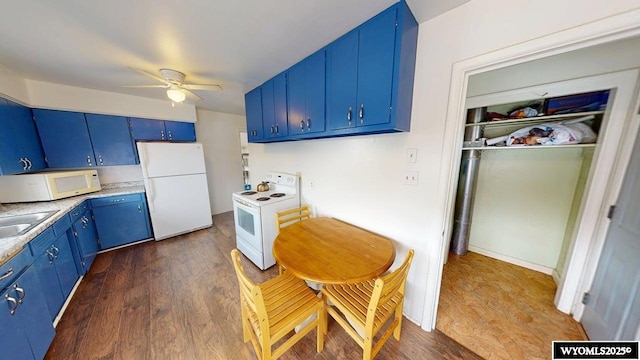 kitchen featuring a sink, white appliances, ceiling fan, blue cabinetry, and light countertops