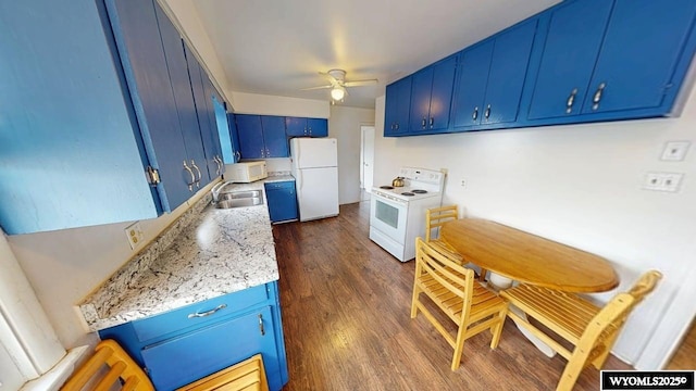 kitchen with a sink, light countertops, blue cabinetry, white appliances, and a ceiling fan