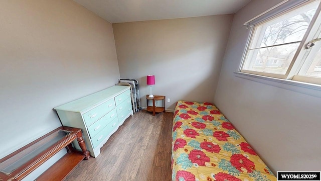 bedroom featuring wood finished floors
