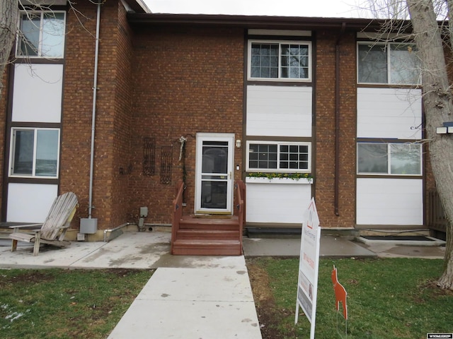 view of front of home with brick siding and entry steps
