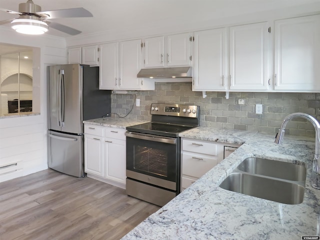 kitchen featuring stainless steel appliances, a sink, white cabinetry, a ceiling fan, and under cabinet range hood
