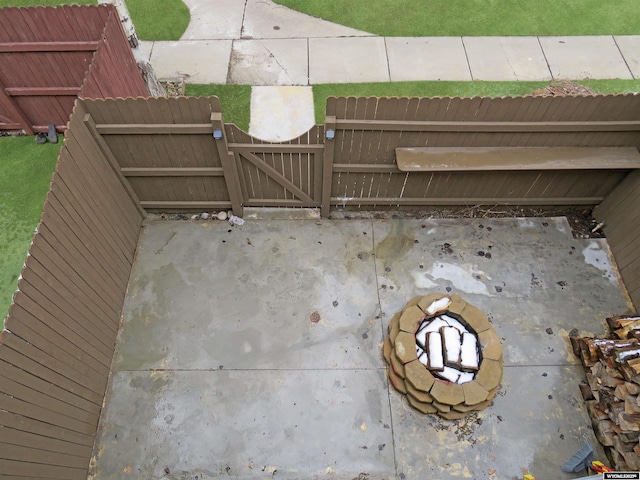 view of patio / terrace featuring a gate and fence