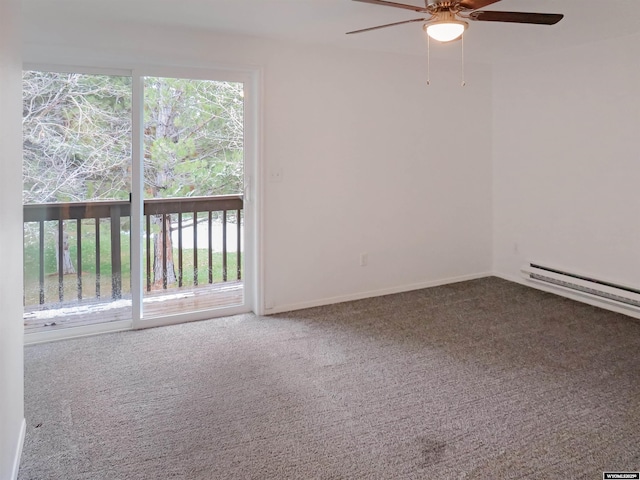 carpeted empty room with a baseboard heating unit, a wealth of natural light, a ceiling fan, and baseboards