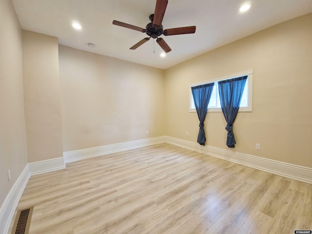 unfurnished room featuring light wood-style floors, ceiling fan, baseboards, visible vents, and recessed lighting
