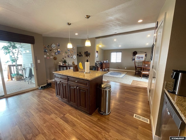 kitchen with recessed lighting, dark brown cabinets, wood finished floors, visible vents, and baseboards