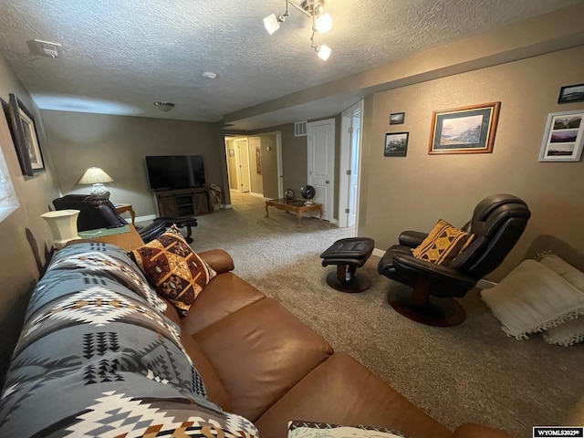 carpeted living area featuring a textured ceiling, baseboards, and visible vents