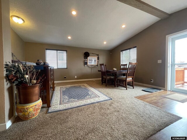 carpeted dining space with plenty of natural light, vaulted ceiling, baseboards, and recessed lighting