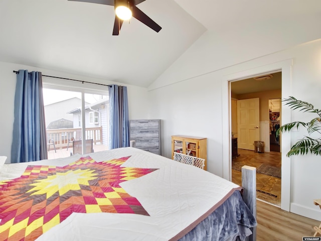 bedroom with vaulted ceiling, a ceiling fan, and wood finished floors