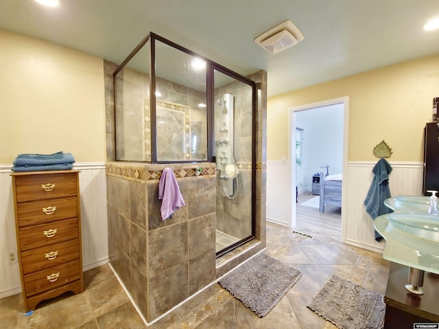 full bath with wainscoting, a shower stall, visible vents, and recessed lighting