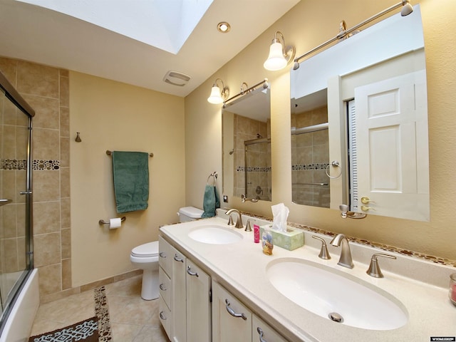 full bathroom with a skylight, tile patterned floors, a sink, and double vanity