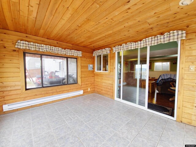 unfurnished sunroom with a baseboard radiator
