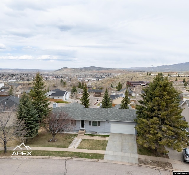 drone / aerial view with a mountain view and a residential view