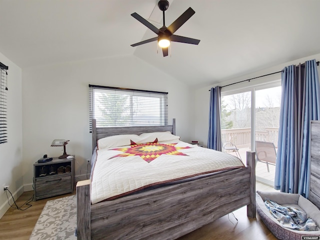 bedroom with lofted ceiling, a ceiling fan, light wood-type flooring, baseboards, and access to outside