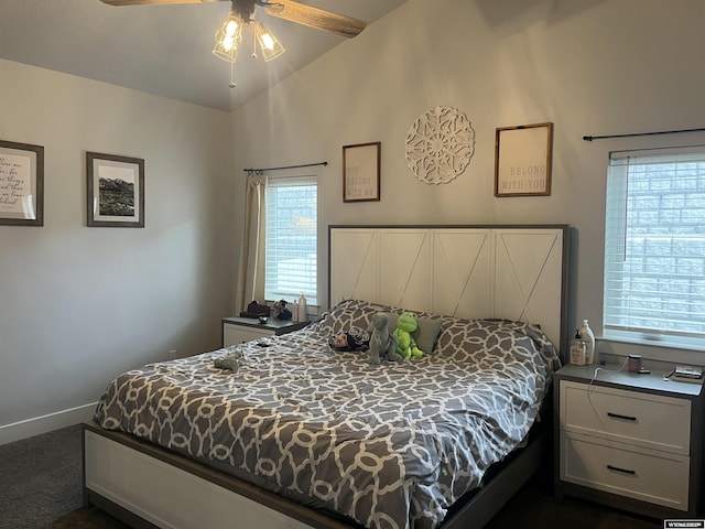 640 Lynn Ct, Green River, WY 82935 - bedroom featuring dark carpet, baseboards, and lofted ceiling