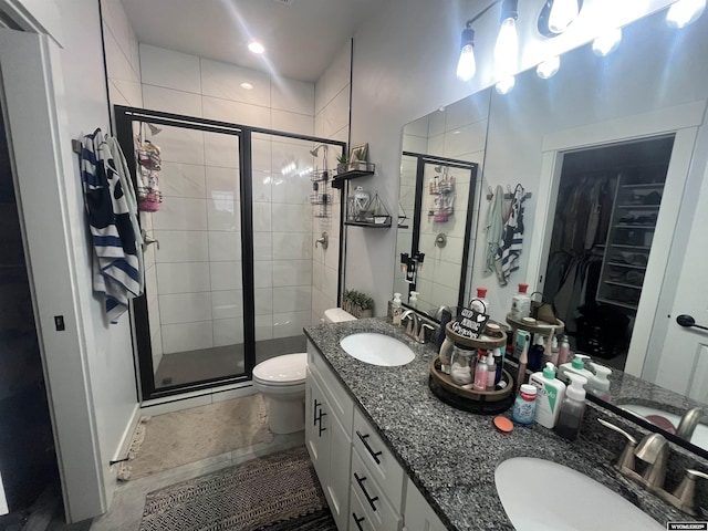 640 Lynn Ct, Green River, WY 82935 - full bathroom featuring a shower stall, a sink, a spacious closet, and double vanity