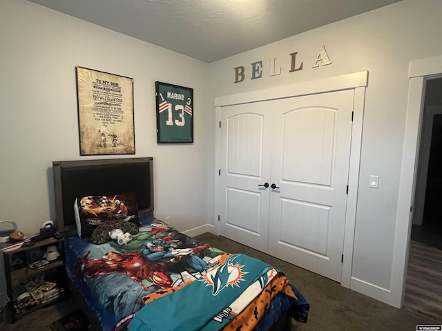 640 Lynn Ct, Green River, WY 82935 - carpeted bedroom featuring baseboards and a closet