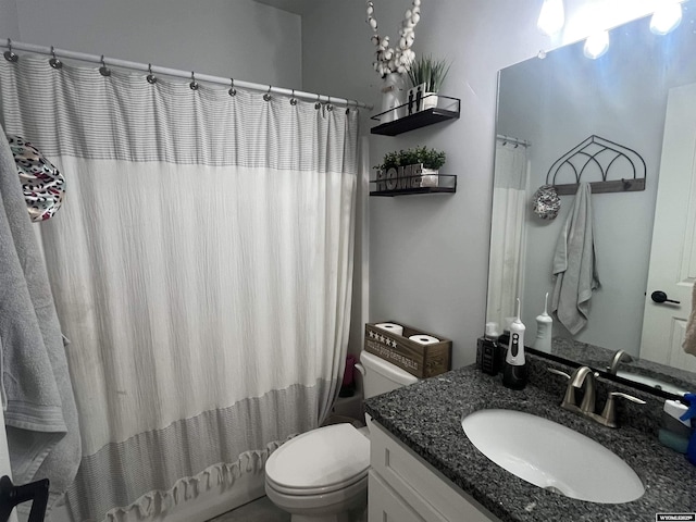 640 Lynn Ct, Green River, WY 82935 - full bath with vanity, a shower with shower curtain, and toilet
