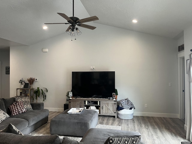 640 Lynn Ct, Green River, WY 82935 - living room featuring baseboards, a ceiling fan, wood finished floors, and vaulted ceiling
