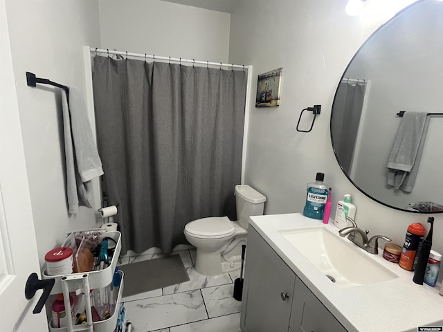 640 Lynn Ct, Green River, WY 82935 - bathroom featuring curtained shower, marble finish floor, vanity, and toilet