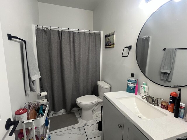 640 Lynn Ct, Green River, WY 82935 - bathroom featuring marble finish floor, toilet, a shower with curtain, and vanity