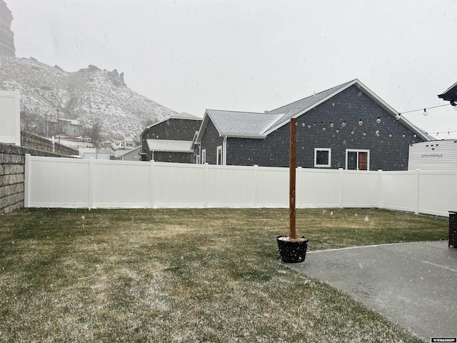 640 Lynn Ct, Green River, WY 82935 - view of yard with a fenced backyard and a mountain view