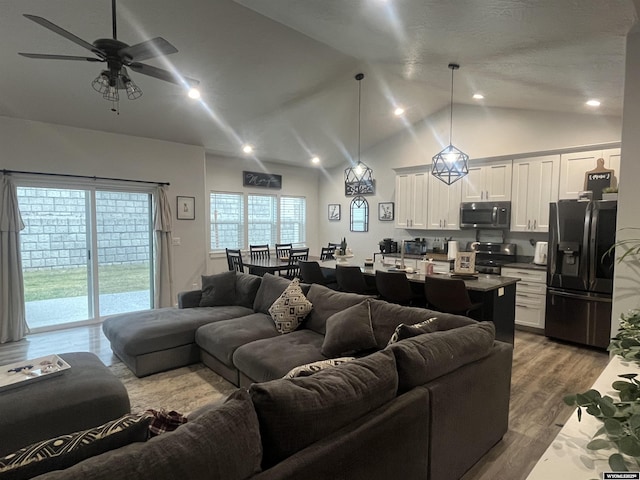640 Lynn Ct, Green River, WY 82935 - living room with dark wood finished floors, lofted ceiling, ceiling fan, and recessed lighting