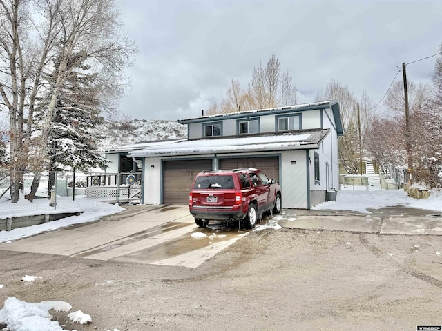 traditional home with driveway and a garage