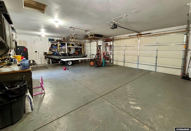 garage featuring a garage door opener
