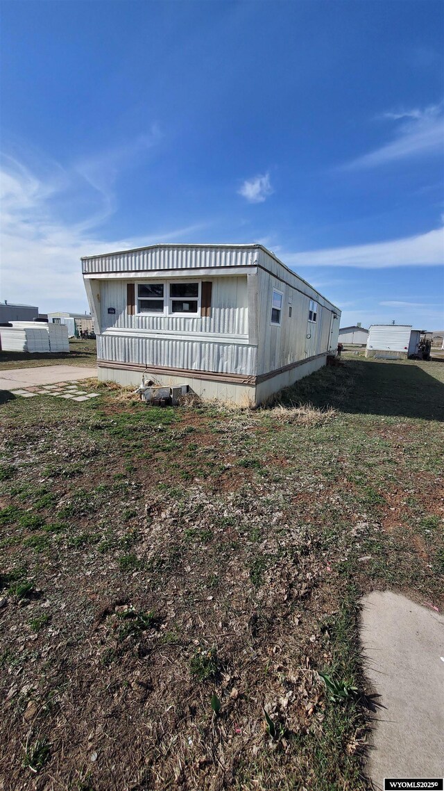 2884LOT1119 Yellowcreek Rd, Evanston, WY 82930 - manufactured / mobile home with a wooden deck