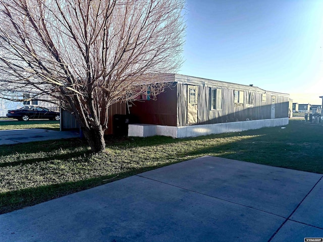 2884LOT1207 Yellow Creek Rd, Evanston, WY 82930 - view of side of home featuring a yard and a patio area