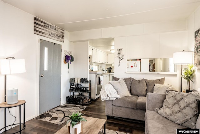 living room featuring dark wood-style floors