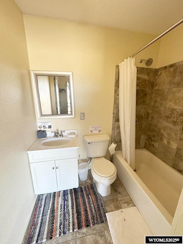 full bath featuring shower / bath combo, toilet, and vanity