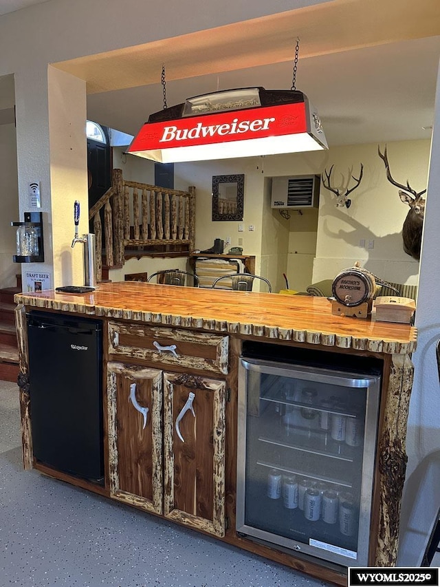 bar with beverage cooler and fridge