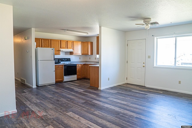 kitchen with under cabinet range hood, white appliances, ceiling fan, light countertops, and dark wood-style flooring